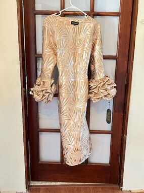 Metallic Gold Long-Sleeve Midi Dress with Ruched Statement Cuffs. Its flattering